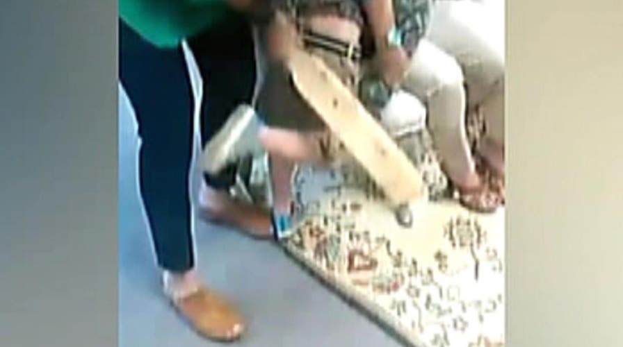 Video of school officials trying to paddle boy goes viral