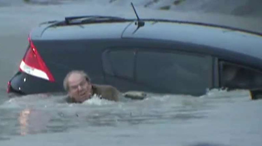 Reporter saves man from dangerous floodwaters in Texas
