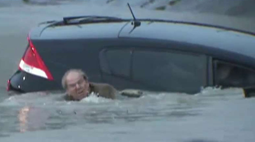 Reporter saves man from dangerous floodwaters in Texas