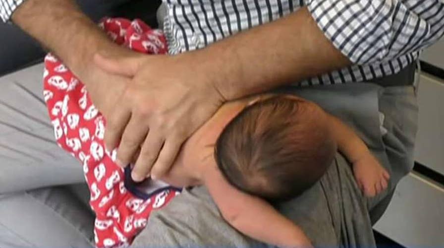 Doctors condemn chiropractor cracking newborn baby's back
