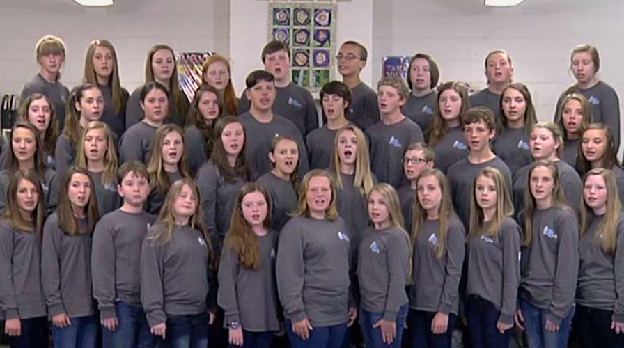 Students singing national anthem at 9/11 Memorial silenced