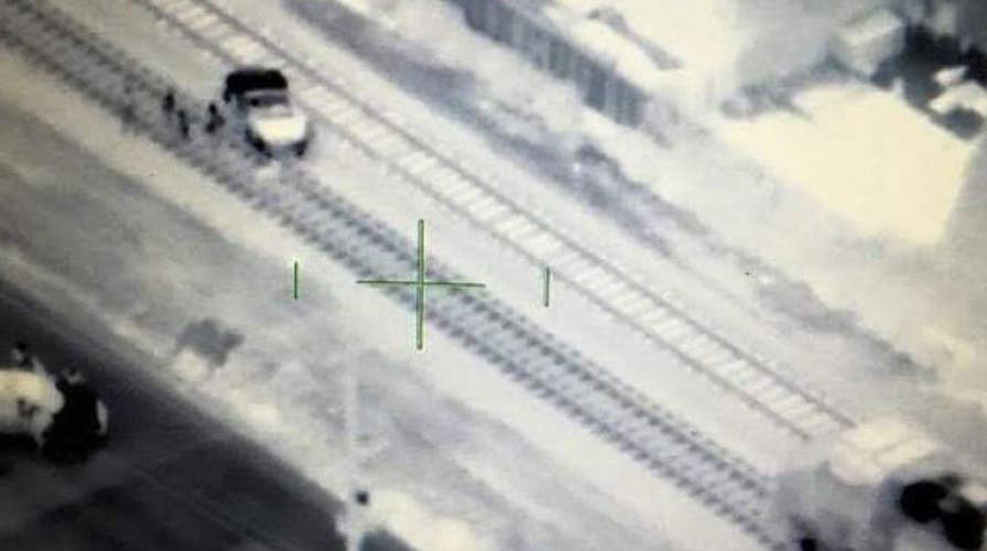 Police chopper crew stops collision between train and car