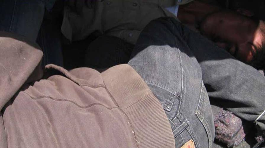 Woman arrested after illegal immigrants found in trunk