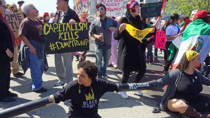 Protests erupt outside site of Trump speech in California