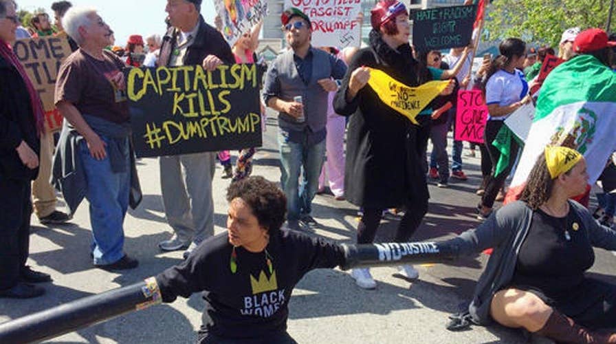 Protests erupt outside site of Trump speech in California