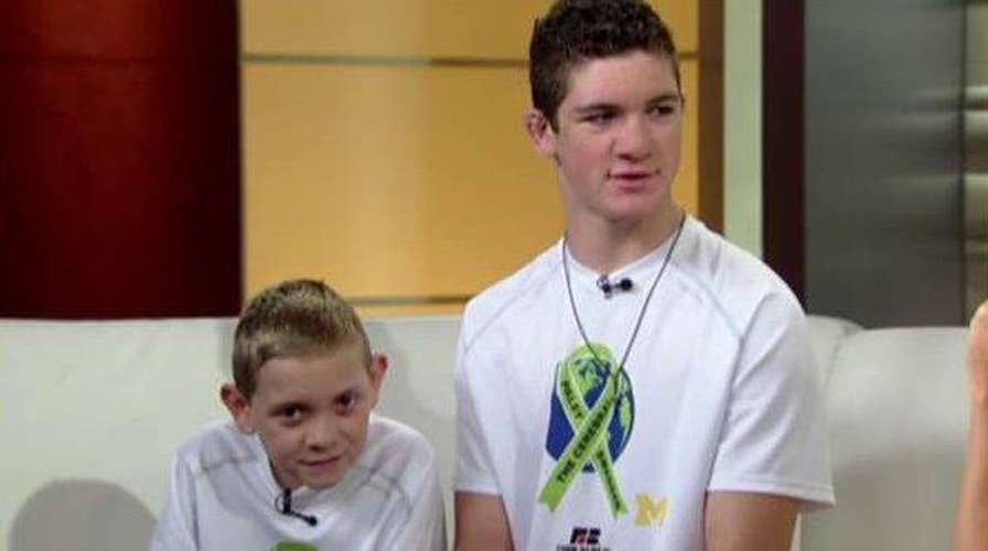 Teen carries brother with cerebral palsy on 111 mile trek