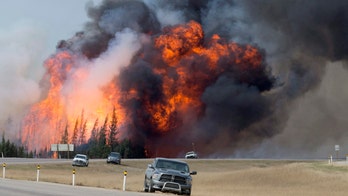 Cooler temperatures, rain give firefighters hope of getting handle on massive Canadian wildfire