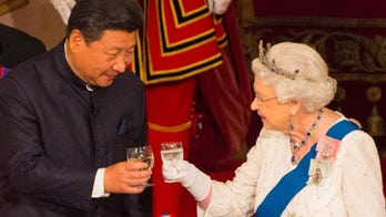 Queen Elizabeth II caught on camera calling Chinese officials 'rude'