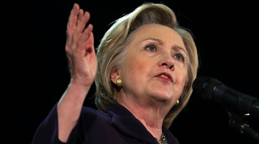 Clinton downplays FBI probe, calls it a 'security inquiry'