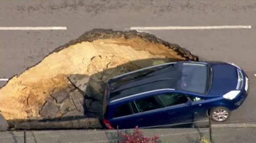 Giant sinkhole swallows car