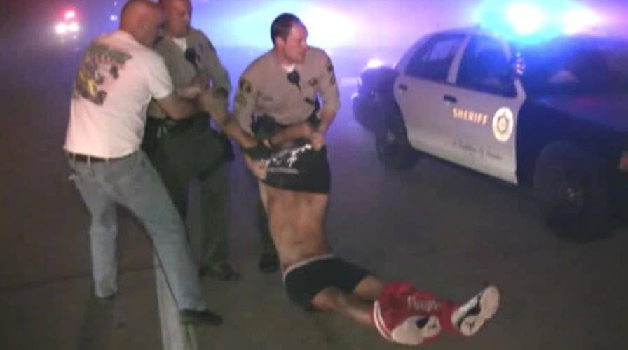 Deputies rescue driver from burning car