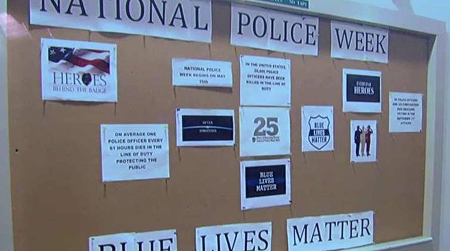 Campus controversy over defacing of pro-police display