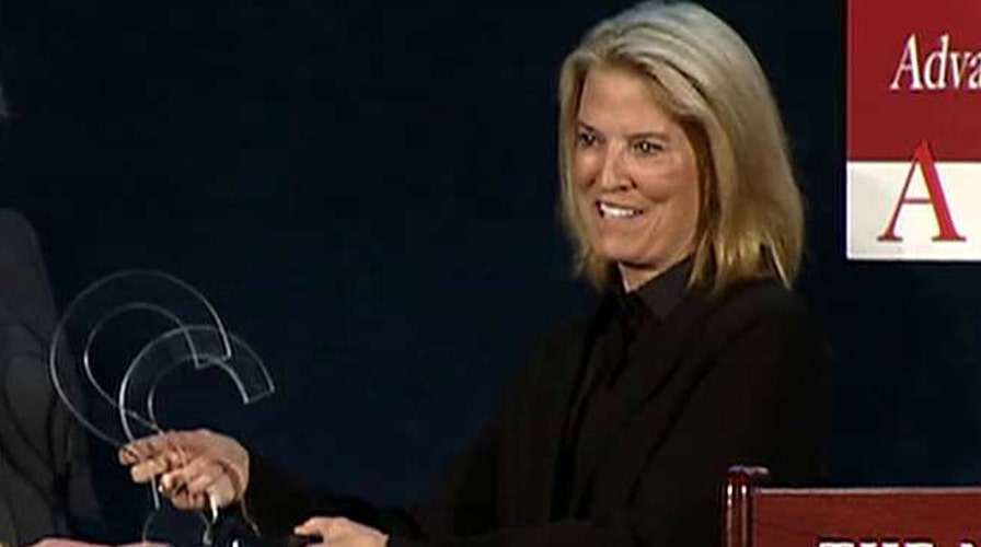 Greta receives Excellence in Journalism award