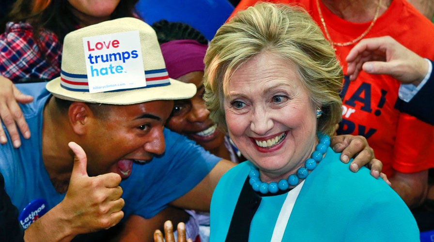 Clinton reveals new campaign slogan