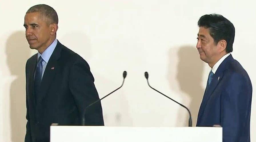 Obama tries to strengthen ties with Japan amid controversy