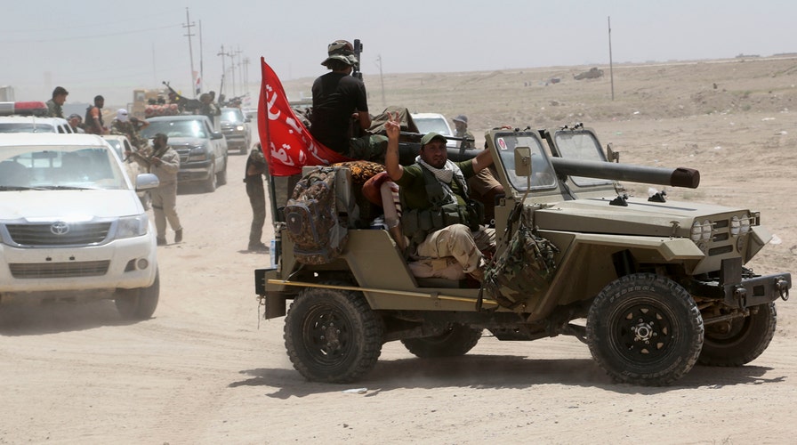 Iraqi forces battling ISIS surround Fallujah