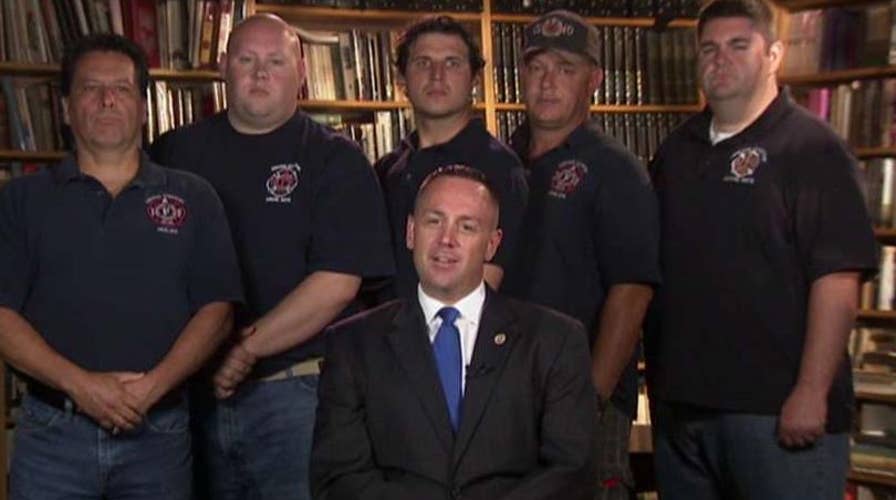 Firefighters compared to terrorists for flying US flags