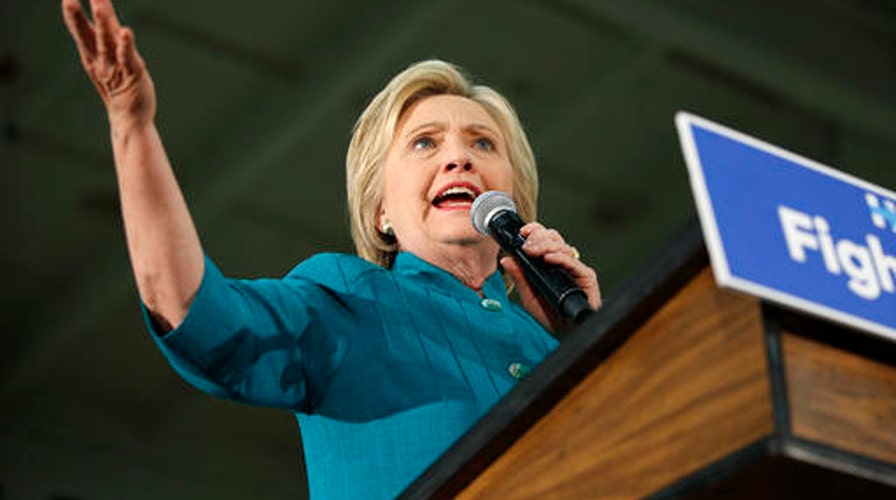 Clinton aide fires back over lack of press conferences