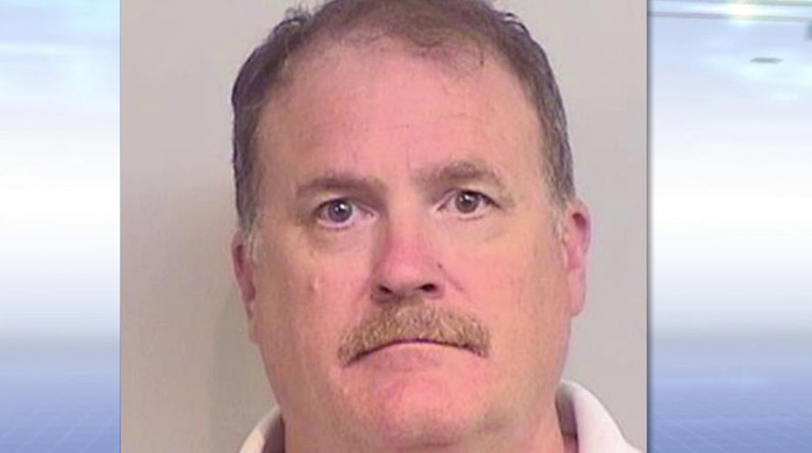 Former astronaut charged with killing two girls in crash