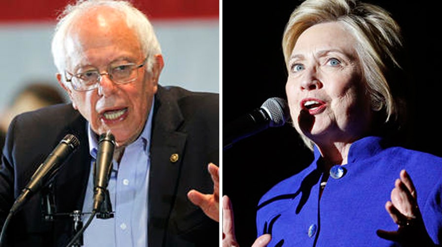 Sanders refusing to bow out despite Clinton making history