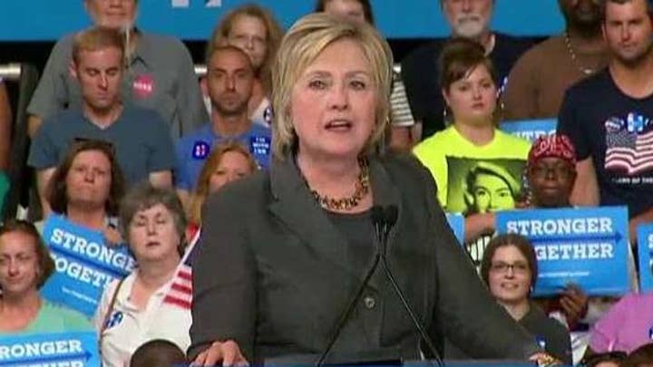 Clinton pushes for party unity as she touts economic plan