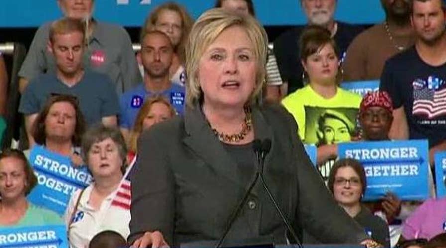 Clinton pushes for party unity as she touts economic plan