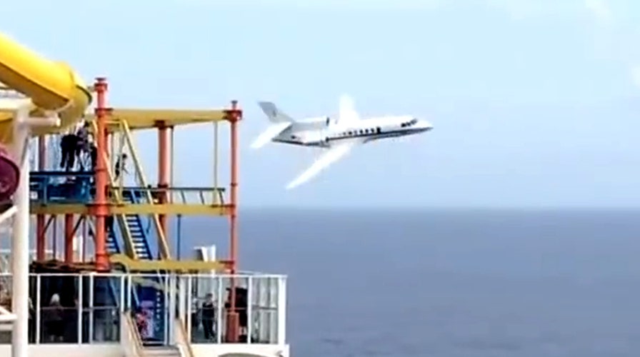 Military jet buzzes cruise ship in the Atlantic Ocean