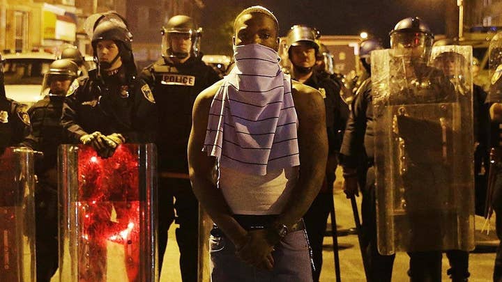How gap between police, black community worsened under Obama