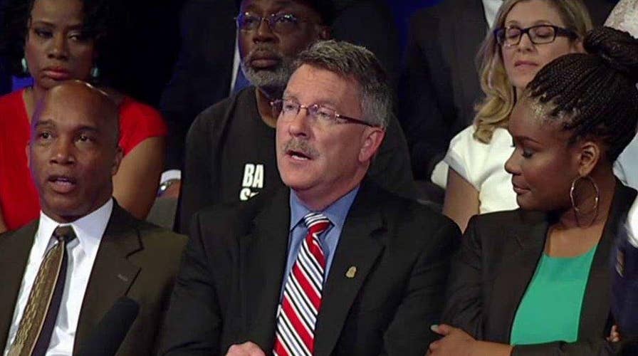 Debate over healing the racial divide in America