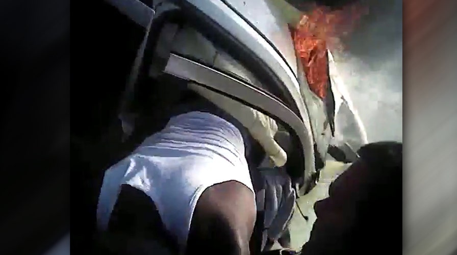 Hero cops pull robbery suspect from burning car after chase