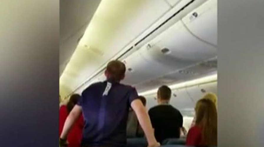 High school choir honors WWII soldier during flight