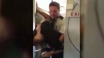 Pilot tackles drunk passenger accused of attacking flight attendant