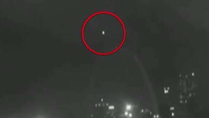 Mystery light in the sky hovers over St Louis Gateway Arch