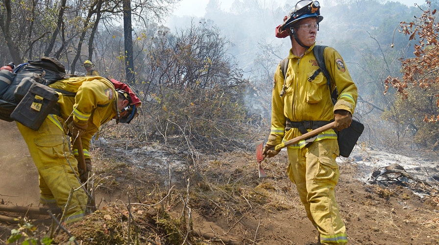 Firefighters battle devastating wildfires in California