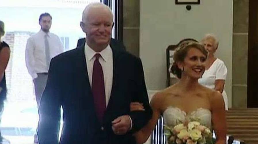 Heart transplant recipient walks donor's daughter down aisle