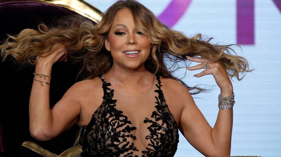 Mariah Carey billboard shows too much cleavage