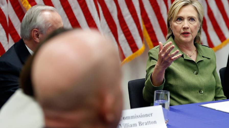 Clinton holds roundtable with law enforcement officials