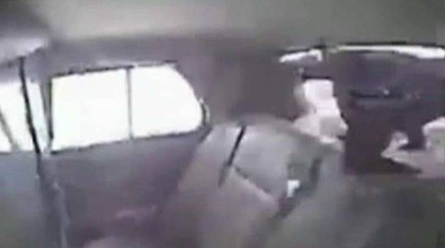 Cop car crashes, sends inmate flying out rear windshield