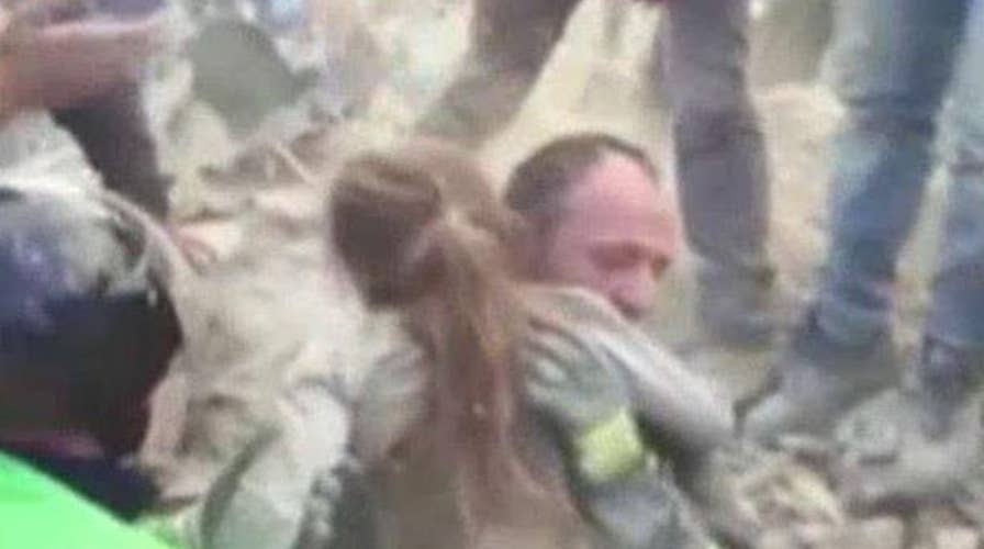 Girl found alive 17 hours after Italy earthquake