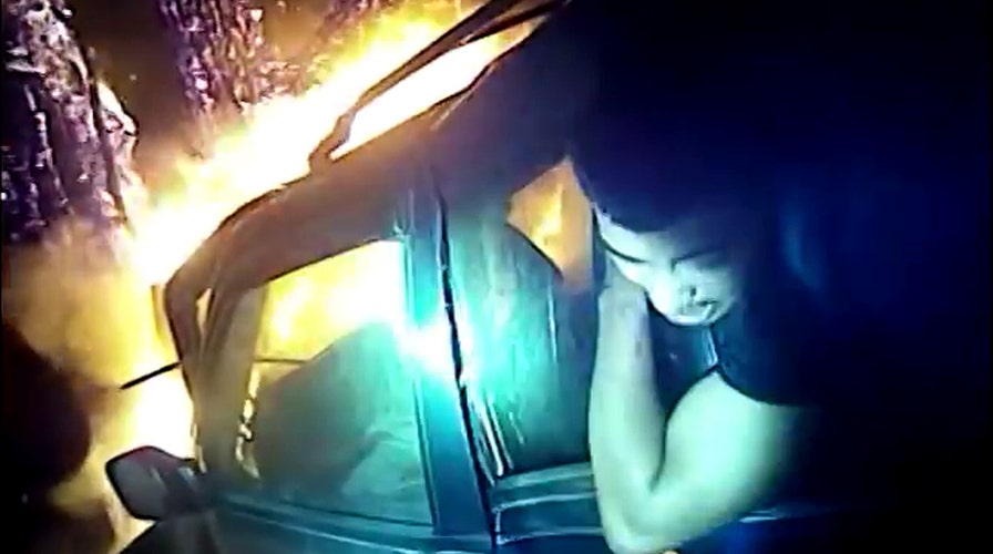'It's gonna blow up!' Hero cop saves man from burning car