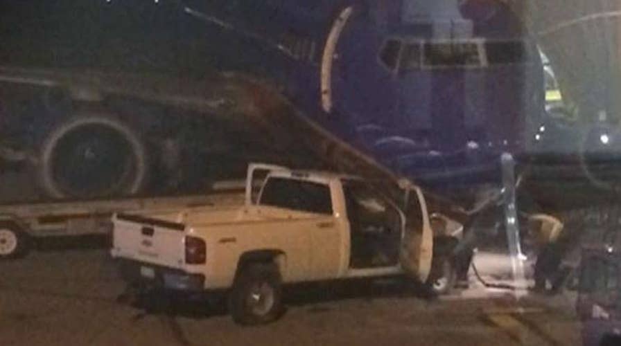 Nearly naked man rams pickup truck into airplane