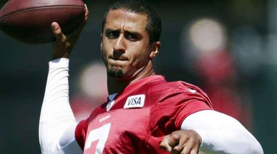 Kaepernick defends choice to sit during national anthem