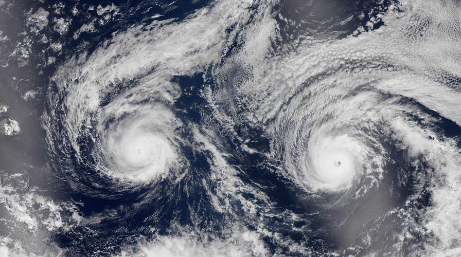 Twin storms bear down on Hawaii