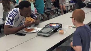 Florida football player  befriends autistic boy at lunch