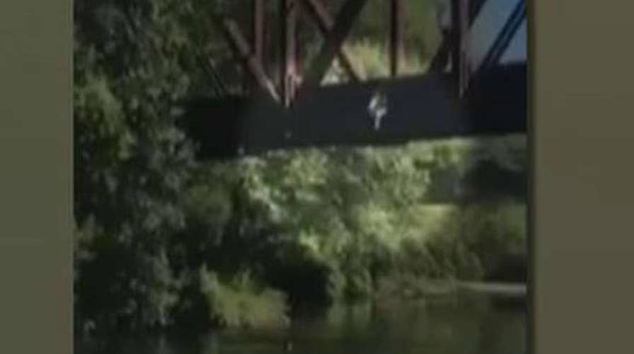 Four-year-old boy tossed off bridge into river
