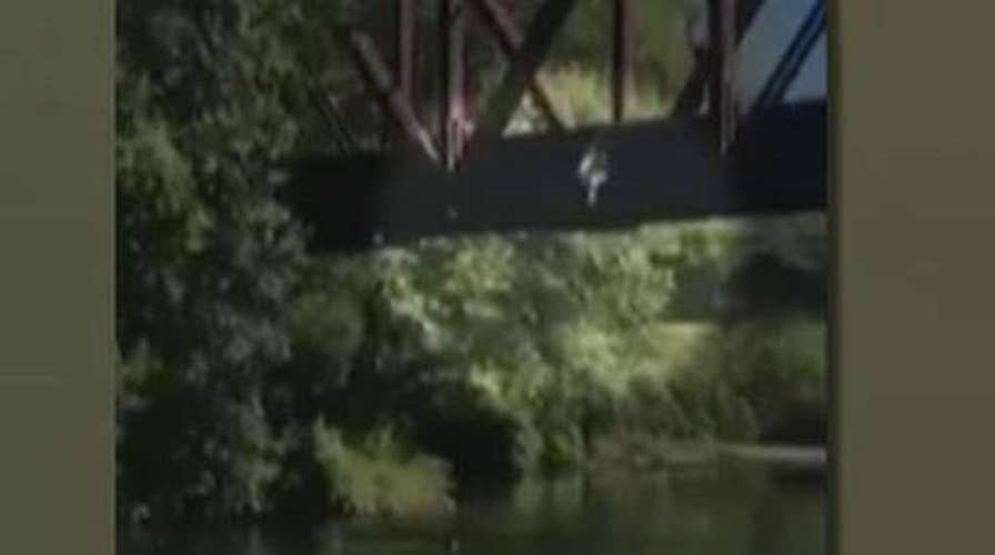 Four-year-old boy tossed off bridge into river
