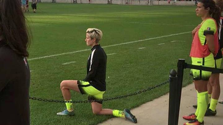 US soccer star kneels for national anthem