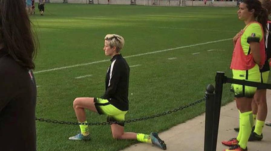US soccer star kneels for national anthem