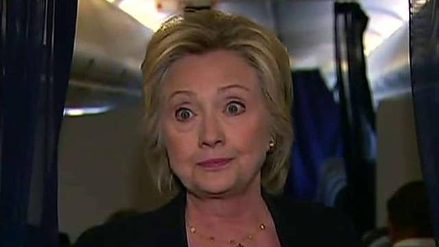 Clinton holds impromptu news conference on campaign jet