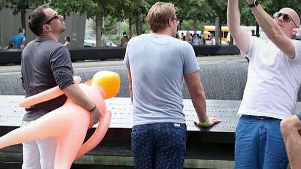 Men snap selfies with blow up doll at 9 11 memorial